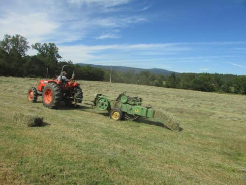 Terry baling hay with John Deer baler  2015