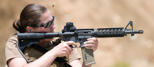 Female soldier w assault rifle
