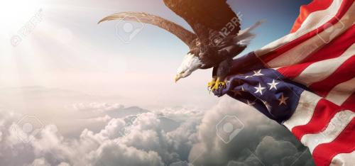 123144546-eagle-with-american-flag-flies-in-freedom