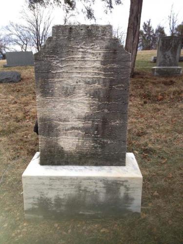 ghostly face on tombstone