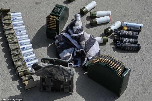 47322147-9942593-American_made_ammunition_left_behind_by_retreating_forces_has_no-a-82_1630436646421