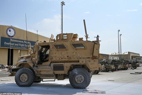 47321525-9942593-An_American_MRAP_vehicle_is_pictured_at_Kabul_airport_alongside_-a-69_1630434645521
