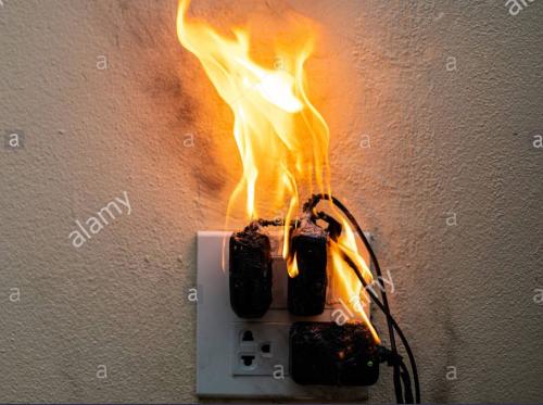 on-fire-adapter-at-plug-receptacle-on-white-background-electric-short-circuit-failure-resulting-in-electricity-wire-burnt-2A1AYKR~2