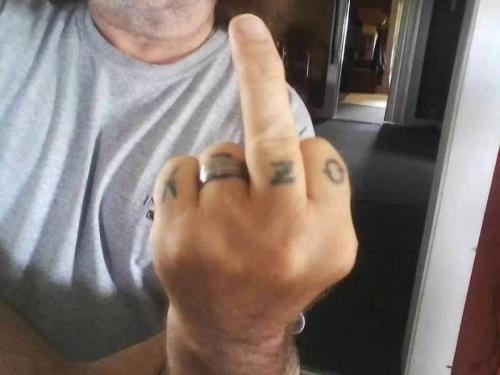 OZZY TAT HAND FUCK YOU