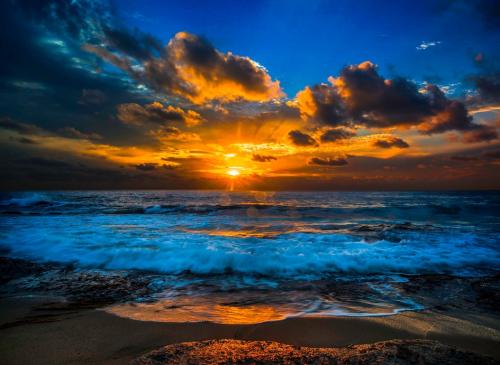 Orange sunset through clouds