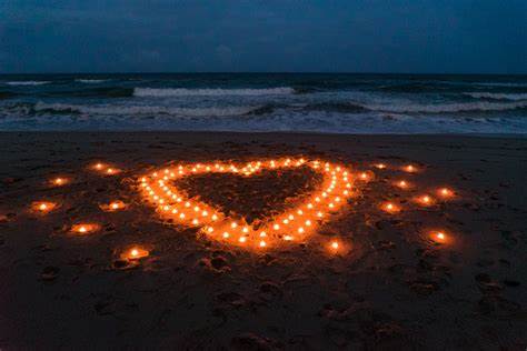 Lighted heart on beach