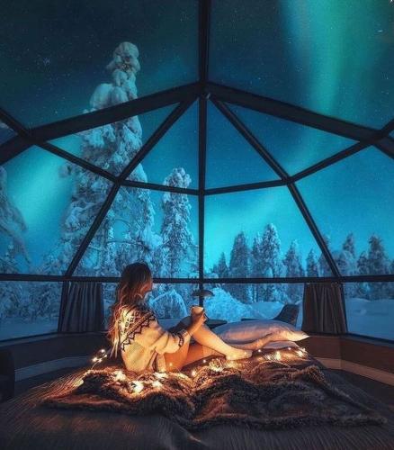 Woman in clear cabin in snow