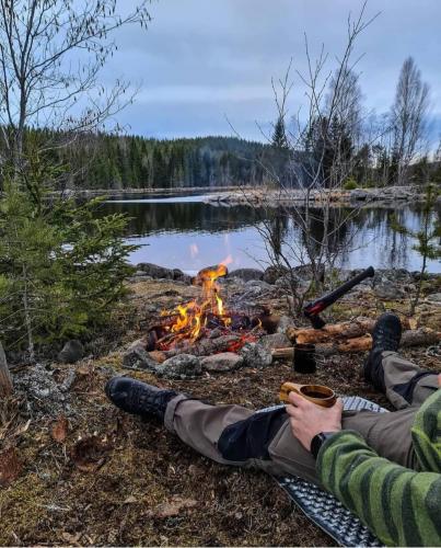 Relaxing small campfire and coffee in mountains