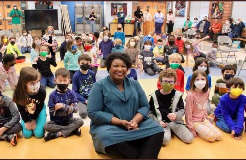 Stacey Abrams with school kids no mask 1080 x 703