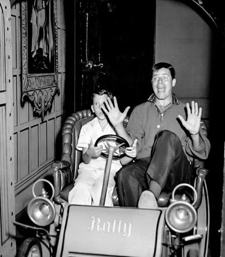 Jerry Lewis and his son Gary on a ride at Disneyland in 1955