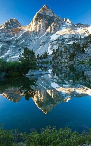 Majestic snowy mountain peak reflection