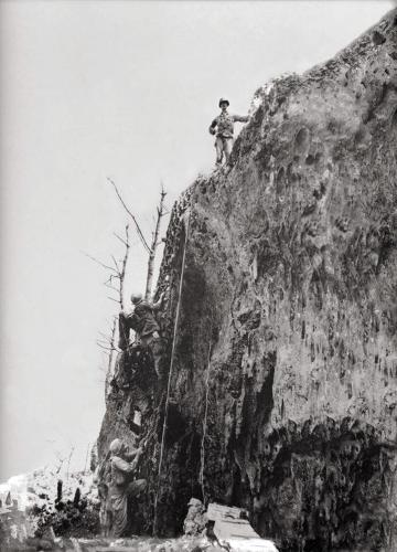 Actual photograph of United States Army Medic Desmond T Doss standing on top of Hacksaw Ridge during World War II Okinawa 1945_WEB