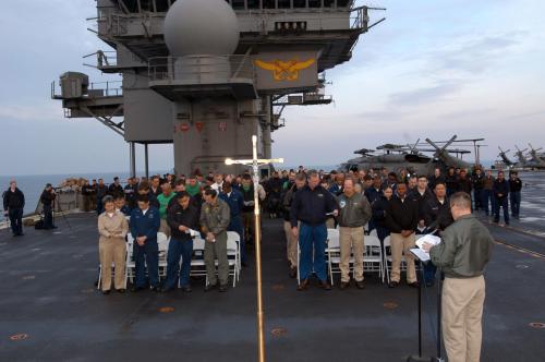 US_Navy_050327-N-8604L-002_Sailors_aboard_the_conventionally_powered_aircraft_carrier_USS_Kitty_Hawk_(CV_63)_attend_Easter_Sunrise_Service_on_the_flight_deck_aboard_the_ship