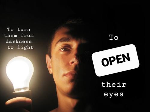 man-holding-lit-bulb