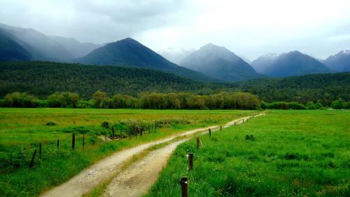 Green path to cloudy hills