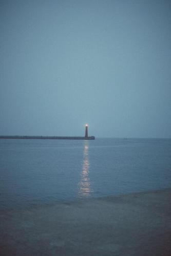 Lighthouse at a distance in fog