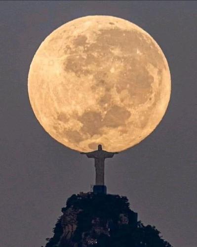 Full moon over Jesus in Brazil