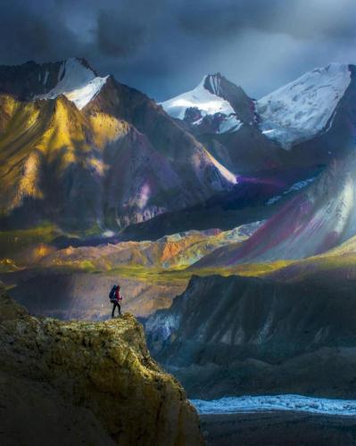 Hiking the sunglow in snowy mountains