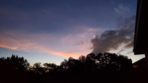 Sunrise with the moon just being a sliver