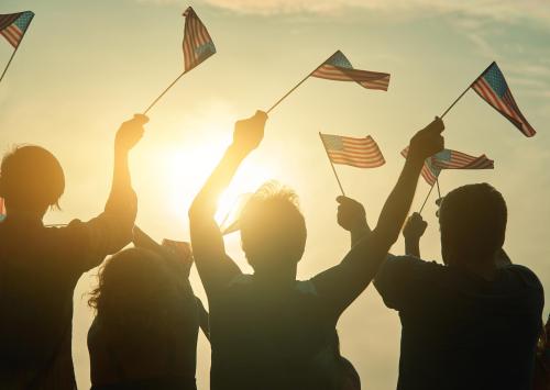 people-raising-usa-flags-in-the-air-2023-11-27-05-34-13-utc