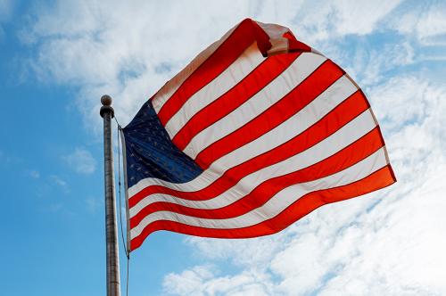 united-states-of-america-flag-on-the-blue-sky-2022-11-12-11-07-32-utc