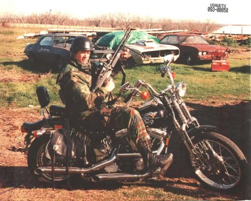 FBI HRT agent armed with an M60E4 GPMG posing with David Koresh's motorcycle during the aftermath of the Waco Siege Reddit forgotten weapons