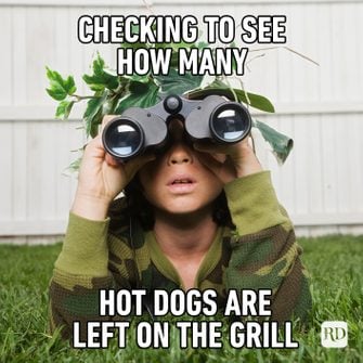 Checking-to-see-how-many-hot-dogs-are-left-on-the-grill
