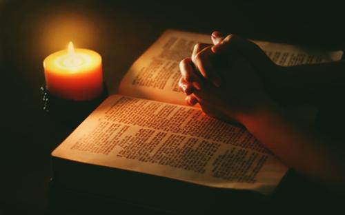 bible-candle-praying-hands
