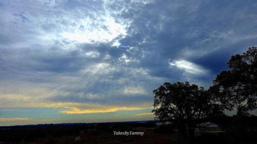 Sunrise, sun rays and clouds